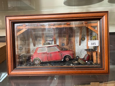 Lot 385 - A cased display of a 1966 model Mini Cooper...