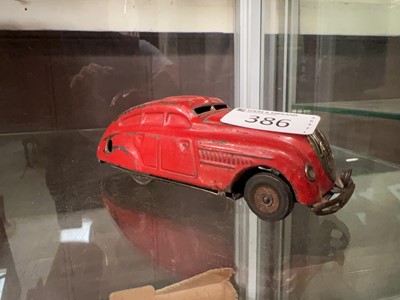 Lot 386 - A mid-20th century Schuco 1750 red wind-up car