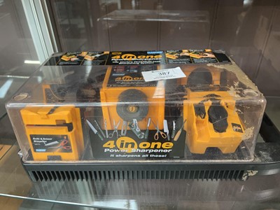 Lot 387 - A cased Plasplugs 4-in-1 power sharpener