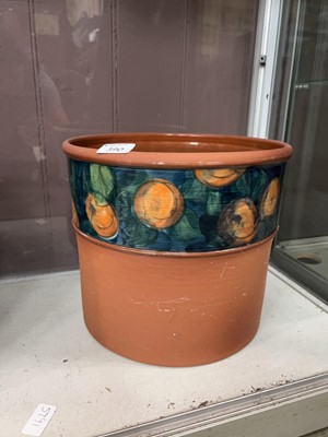 Lot 390 - A terracotta garden planter with glazed fruit...
