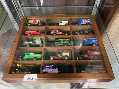 Lot 393 - A modern wall-mounted display case containing...