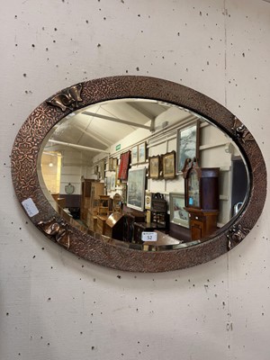 Lot 52 - An arts and crafts style copper framed oval...