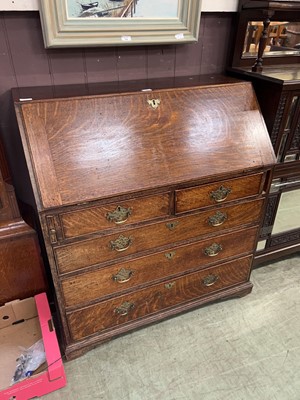 Lot 59 - A late Victorian oak bureau with fall over two...