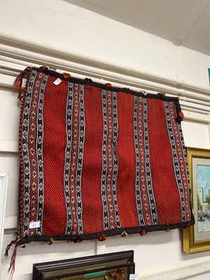 Lot 67 - A mid-20th century eastern handwoven red...