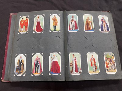 Lot 428 - A mid-20th century cigarette card album with...