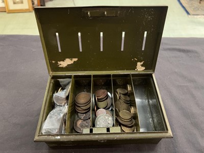 Lot 434 - A green metal cash tin containing assorted...