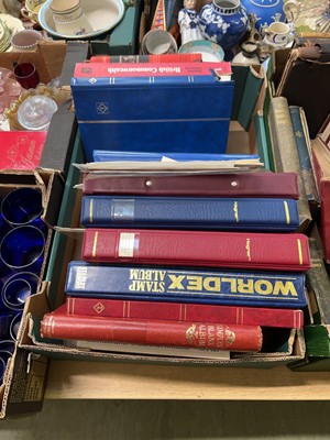 Lot 443 - A tray containing a quantity of stamp albums...