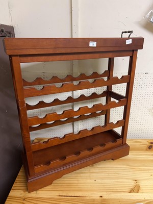Lot 18 - A mahogany effect twenty-four bottle wine rack...