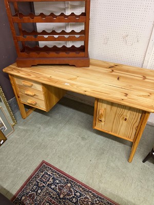 Lot 19 - A modern waxed pine kneehole desk with three...