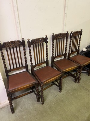 Lot 24 - Four carved oak rail-back dining chairs with...