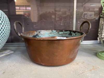 Lot 304 - A brass and copper twin handled basin