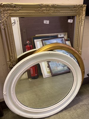 Lot 35 - A rectangular framed wall mirror along with...