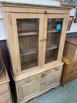 Lot 81 - A stripped pine full height bookcase with...