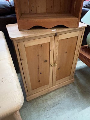 Lot 93 - A 20th-Century stripped pine cupboard with two...