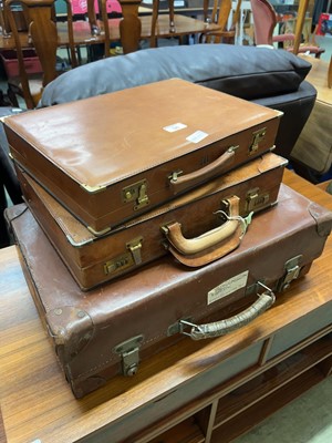 Lot 96 - A leather suitcase along with two leather...