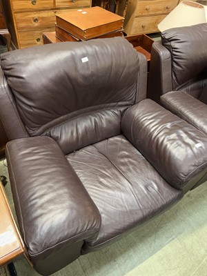 Lot 104 - A modern brown leather upholstered armchair