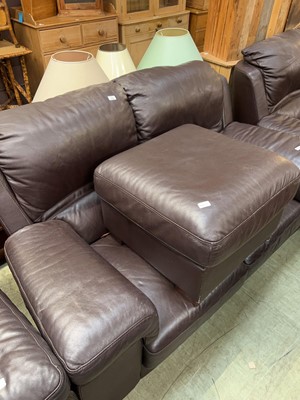 Lot 105 - A modern brown leather upholstered two-seater...