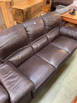 Lot 106 - A modern brown leathered three-seater sofa