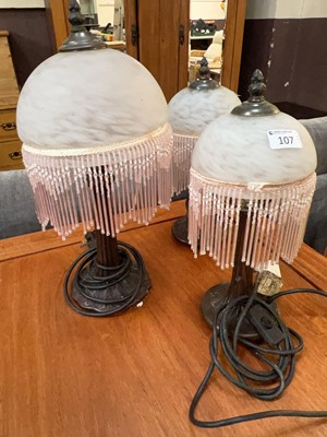 Lot 107 - A moulded table lamp with foliate design and...