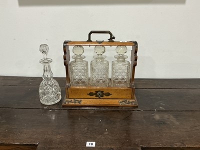 Lot 78 - A late Victorian oak three-bottle tantalus...