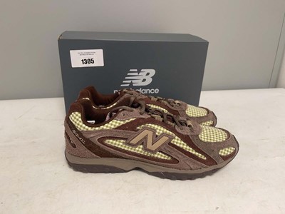 Lot 1305 - New Balance UK7.5 204L trainers in brown - boxed