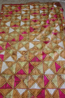 Lot 12 - A Punjabi silk embroidery in pinks and yellows...