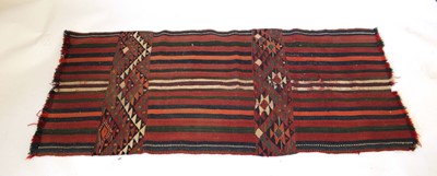 Lot 13 - An Eastern kilim woven in red with stripes and...