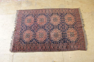 Lot 15 - A 20th century wool rug decorated with eight...