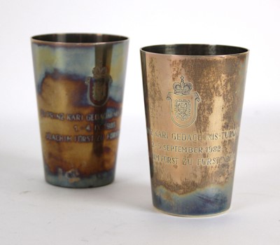 Lot 254 - A pair of German engraved silver goblets,...