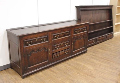 Lot 4 - An 18th century oak dresser, the three-tier...