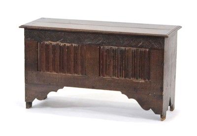 Lot 9 - A Georgian oak coffer, the chamfered lid...