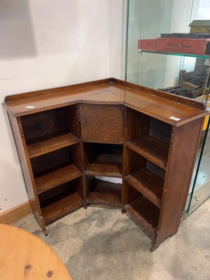 Lot 1002 - Dark oak corner bookcase with single upper door