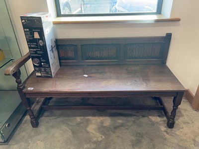 Lot 1003 - Dark oak corner bench seat with linen fold...
