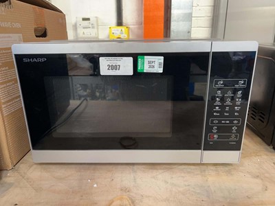 Lot 2007 - Sharp digital microwave oven in black and...