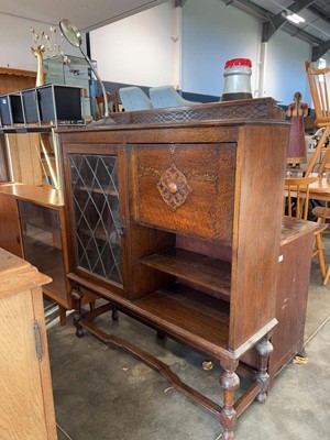 Lot 1028 - Dark oak cabinet with single leaded glass...
