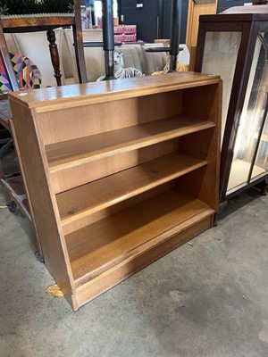 Lot 1037 - Mid Century honey oak open fronted bookcase
