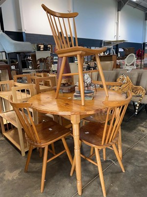 Lot 1053 - Pine circular dining table and 4 matching...