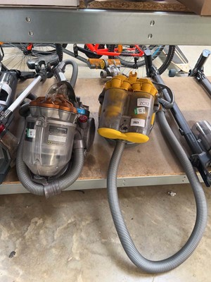Lot 2027 - 2 Dyson Cyclone vacuum cleaners, together with...