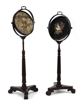 Lot 16 - A pair of William IV rosewood pole screens...