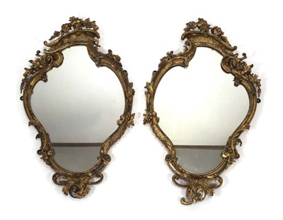 Lot 17 - A pair of giltwood and plaster wall mirrors,...
