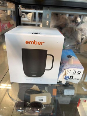 Lot 1740 - Ember temperature controlled mug together with...