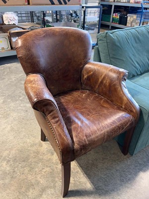 Lot 1181 - Leather open armchair on wooden supports
