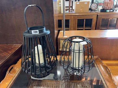 Lot 1190 - 2 black lanterns with candles