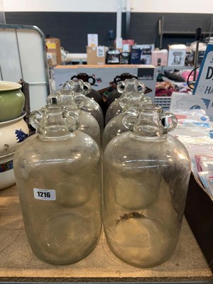 Lot 1216 - Eight glass demijohns
