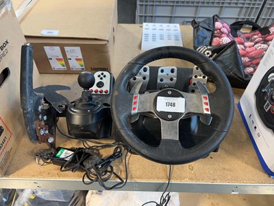 Lot 1748 - Logitech steering wheel together with pedals...