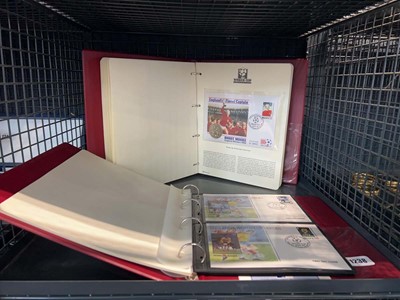 Lot 1238 - 2 folders of First Day Issue World Cup stamps...