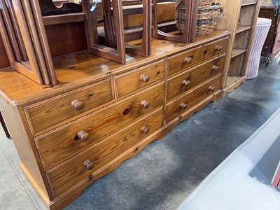 Lot 1124 - Imposing pine lowboy with an arrangement of 8...