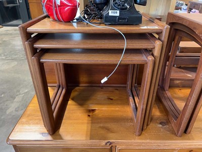 Lot 1125 - Mid century teak nest of 3 coffee tables