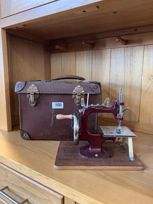 Lot 1131 - Small hobby miniature sewing machine in a...