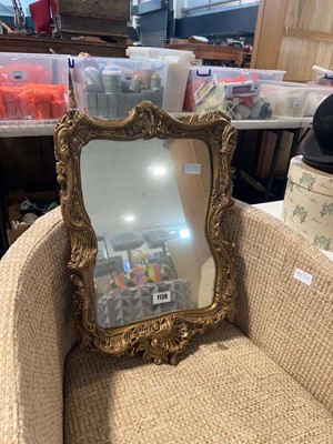 Lot 1138 - An ornate gilt framed wall mirror